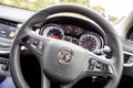 Steering wheel and dashboard of a new Vauxhall Opel Astra vehicle prepared for the next trip