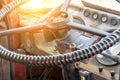 Steering wheel and a dashboard of an old school bus, public passenger bus interior Royalty Free Stock Photo