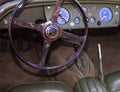 Steering wheel and interior of an old-fashioned car Royalty Free Stock Photo