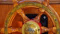 Steering wheel of motorboat, taking matters. Giving direction. A maritime course. Navigate to your goal. Wooden design.