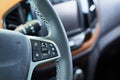 steering wheel of a new modern car with audio control buttons and calls, close up, selective focus Royalty Free Stock Photo