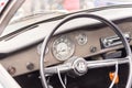 The steering wheel of a retro car, Agde, France. Close-up.