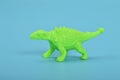 Stegosaurus dinosaur plastic toy animal isolated on a blue background