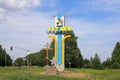 Stele with the coat of arms at the entrance to the city of Tutaev. Russia, Yaroslavl Region, July 17, 2021