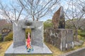 Stele dedicated to the Japanese haiku poet Haruto Kuma aside an atomic bomb memorial monument.