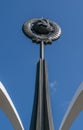 A monument of the Soviet era hammer and sickle on the background of blue sky Royalty Free Stock Photo