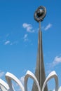 A monument of the Soviet era hammer and sickle on the background of blue sky Royalty Free Stock Photo