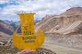 Stella on the road to Kumtor gold mine with inscription Barskoon mountain pass