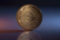 Stellar Lumens XLM Crypto Physical Coin Placed on reflective surface and lit with orange and blue lights