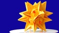 Stellated dodecahedron origami on blue background.