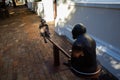 Statue of two monkey`s on a seesaw standing on the pavement in Stellenbosch on a quiet afternoon.