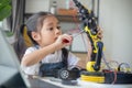 STEM education concept. Asian young girl learning robot design Royalty Free Stock Photo