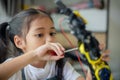 STEM education concept. Asian young girl learning robot design Royalty Free Stock Photo