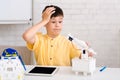 Stem education. Dismayed boy creating robot and made mistake Royalty Free Stock Photo