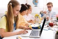 Stem education. Girl programming diy robot with laptop Royalty Free Stock Photo