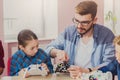 Stem education. Kids creating robots with teacher Royalty Free Stock Photo