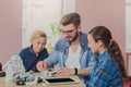 Stem education. Kids creating robots with teacher Royalty Free Stock Photo