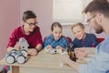 Stem education. Kids creating robots with teacher Royalty Free Stock Photo