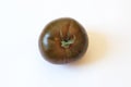 Stem end view of a deep red green Cherokee Purple type organic h