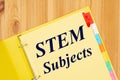 STEM subject type message with file tabs in a yellow binder