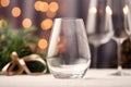 Stemless wine glass mockup with Christmas elements in background. Generative AI