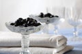 Stemware glasses with olives, close-up