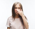 The stench. Closes the woman`s nose Royalty Free Stock Photo