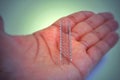 A stent used in angioplasty procedure placed on palm surface
