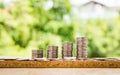 Step of coins stacks with tree growing on top, nature background, money, saving and investment or family planning concept, over su Royalty Free Stock Photo