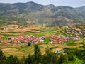 Step farming and houses in a village in a hilly region, India Royalty Free Stock Photo