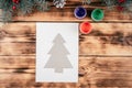 Step-by-step Greeting card Christmas tree with childrens fingerprints tutorial. Step 5: Fix stencil onto tape Royalty Free Stock Photo