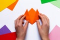 Step by step guide for children how to make an origami cat. Step 4 of 7. Ideas for family leisure time during quarantine. Fine Royalty Free Stock Photo