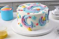 step-by-step guide to making whimsical frosted cake, with swirls, stars and other decorations