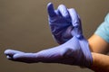 Step of hand throwing away blue disposable gloves medical, Isolated on white background. Infection control concept