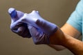 Step of hand throwing away blue disposable gloves medical, Isolated on white background. Infection control concept