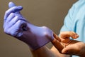 Step of hand throwing away blue disposable gloves medical, Isolated on white background. Infection control concept