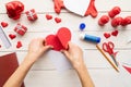 Step by step instruction making paper heart shape hot air balloon. Step 6 - glue the big heart to a piece of hard paper leaving