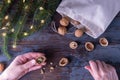 Step by step instructions: DIY golden nut toy. Step 3: In hand, half of a walnut is prepared to extract the kernel. Royalty Free Stock Photo