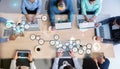 Digital composite of Business people working with devices and computers in meeting room Royalty Free Stock Photo