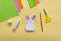 Step by step photo instruction How to make Origami paper bunny with carrot for Easter greetings card.