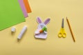 Step by step photo instruction How to make Origami paper bunny with carrot for Easter greetings card.