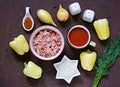 Step by step preparation of stuffed bell peppers, step one, prepared ingredients for cooking on a brown concrete background