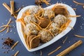 Step by step recipe. Cooking vegetarian energy balls. Step 2 Cooked carrot sweets with nuts, coconut flakes and raisins in heart Royalty Free Stock Photo