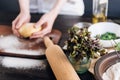 Step by step the chef prepares ravioli with ricotta cheese, yolks quail eggs and spinach with spices. The chef works with the doug Royalty Free Stock Photo