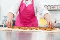 Step-by-step Easter cake, pastry chef prepares dough with raisins for festive kulich Royalty Free Stock Photo