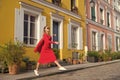 Step by step. Guide to spare time in French capital. Woman total red outfit enjoy walk beautiful street Paris. Parisian Royalty Free Stock Photo