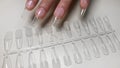 Step-by-step instructions for nail extension on gel tips. Manicure, hands in the foreground.