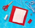 Step-by-step sewing of a protective medical gauze mask on a blue concrete background. Step one, the necessary materials. Royalty Free Stock Photo