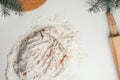 Step-by-step tutorial on baking Christmas gingerbread cookies. Step 9: Put dough on table and continue stirring in flour Royalty Free Stock Photo