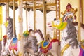 Enchanting Whimsy: Delicate Details of Grey-Maned White Carousel Horses